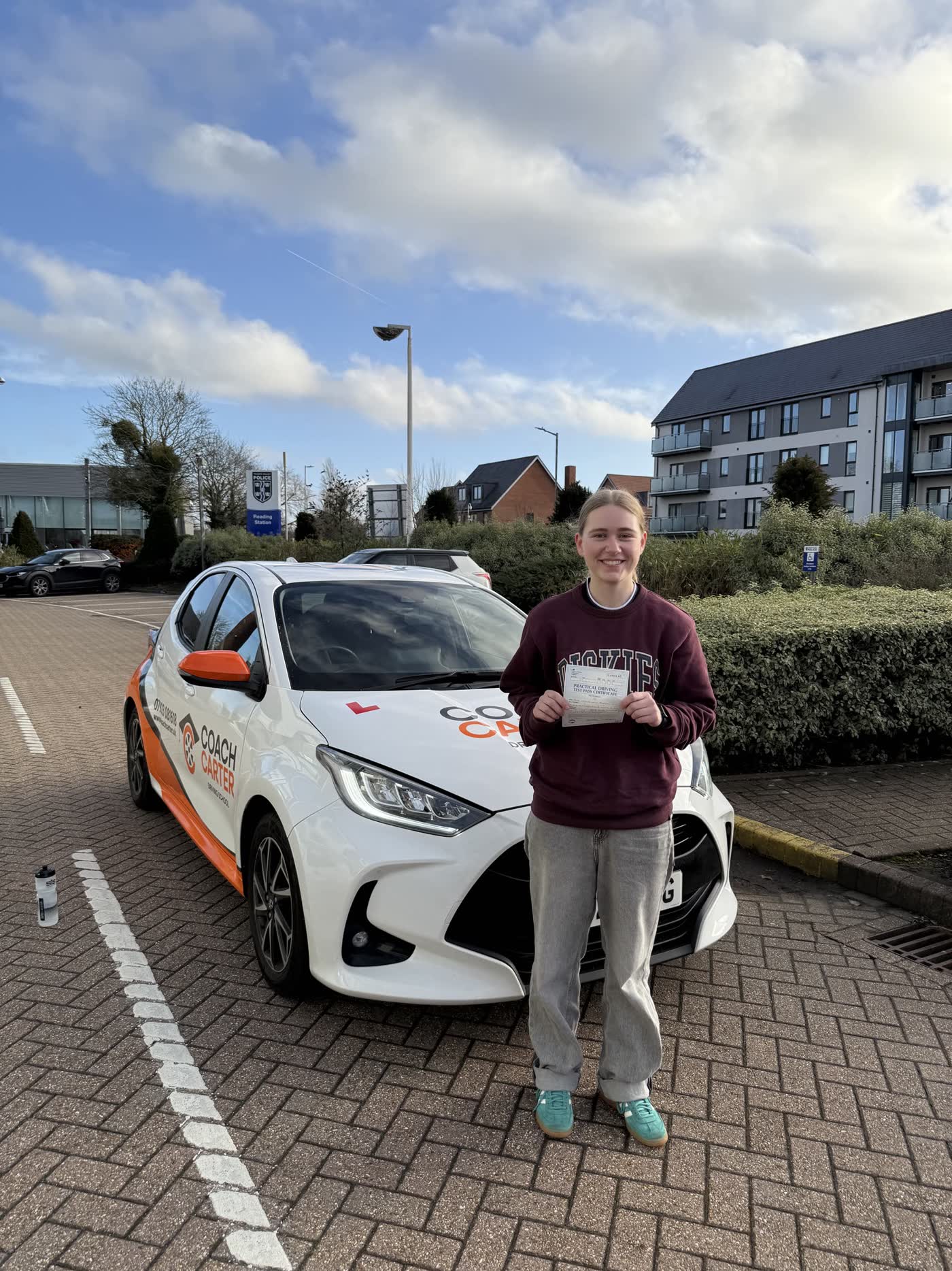 CoachCarter learner holding their driving test pass certificate